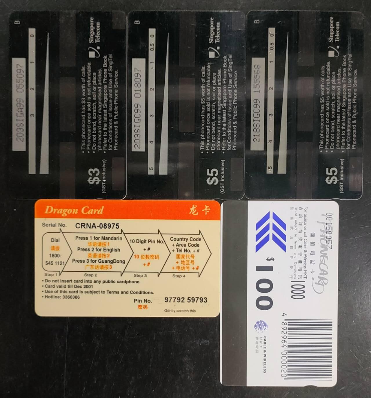 公藏第42期裸卡拍卖 香港，新加坡电话卡（龙系列卡，储值卡，生肖猴，生肖狗。天蝎行动）5枚旧卡合拍，流通品。