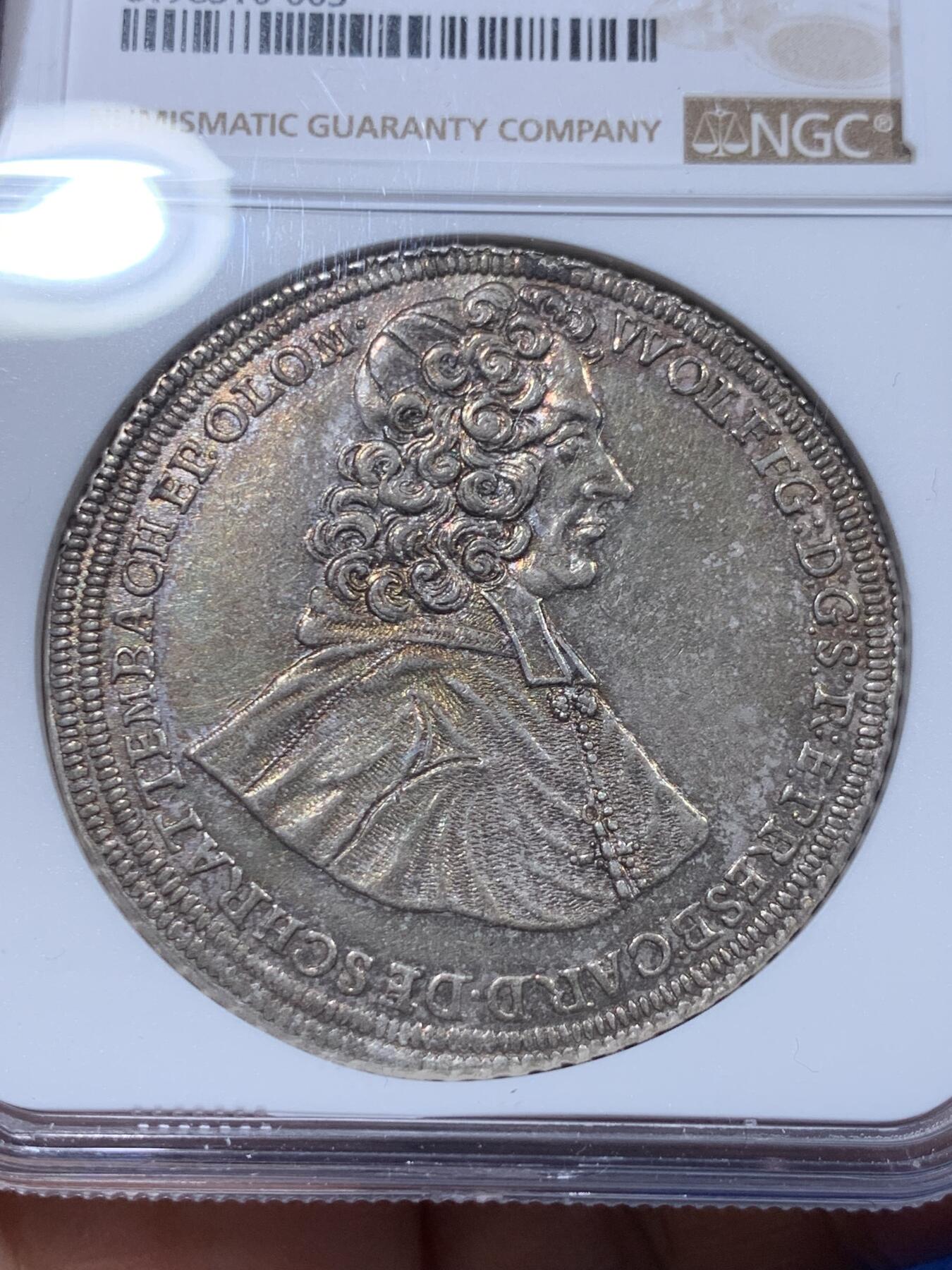 《竞宝斋》第373场 周日，周一，周二 3场连拍 （全场包邮） NGC UNC 神圣罗马帝国波西米亚王国奥尔穆茨主教区1716年泰勒大银币 币面打制清晰，高点具在，黑五彩包浆，单一年份  这个头像还是首见