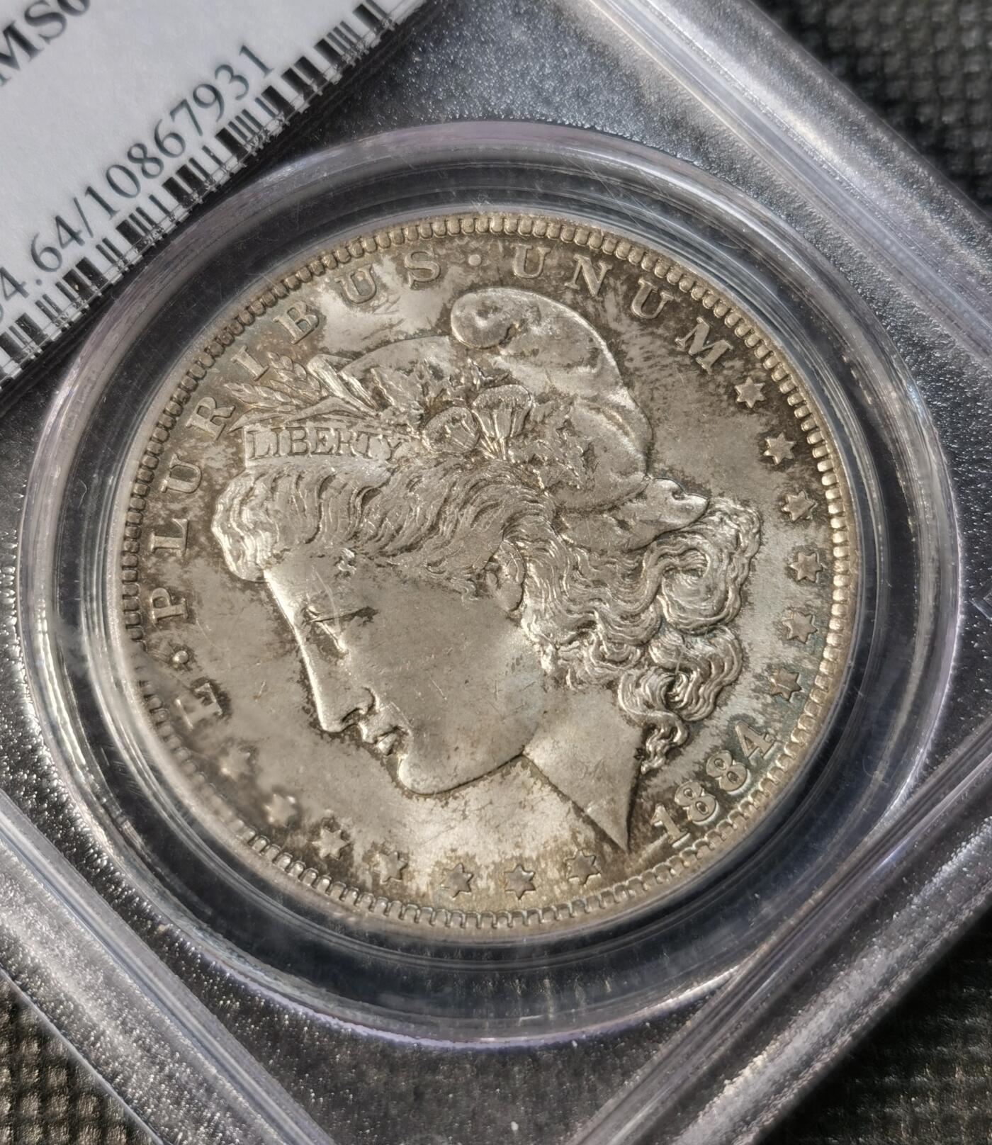  甄臻铺-世界币章拍卖（第14期）送拍享返佣金等优惠多多 NGC-MS64 美国1884年摩根银币O版，原汁原味五彩老包浆，打制精美，状态一流，P盒老白盒严评