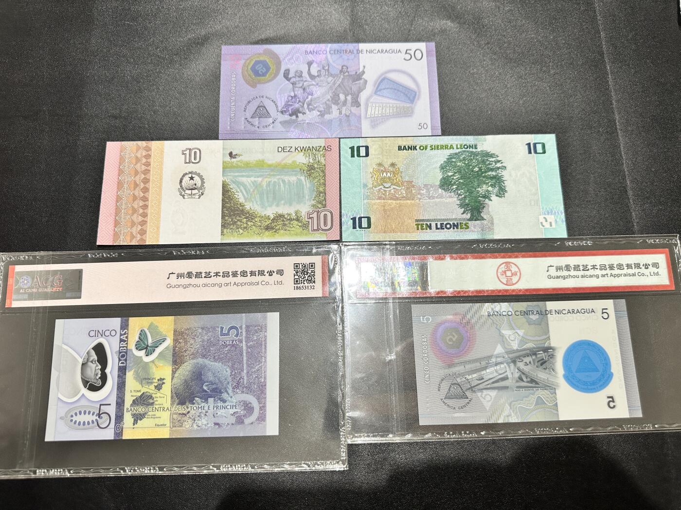 《外钞收藏家》第五百一十七期（五一假期畅拍场）（本平台长期征集拍品、欢迎联系） 圣多美、塞拉利昂、安哥拉、尼加拉瓜五张一起 爱藏评级 +全新裸币 安哥拉轻微潮