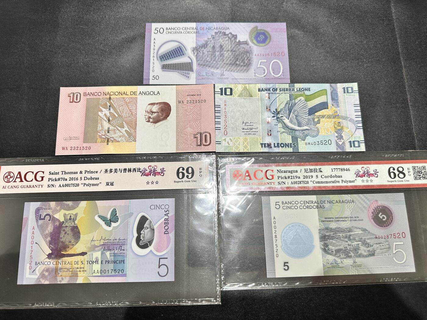 《外钞收藏家》第五百一十七期（五一假期畅拍场）（本平台长期征集拍品、欢迎联系） 圣多美、塞拉利昂、安哥拉、尼加拉瓜五张一起 爱藏评级 +全新裸币 安哥拉轻微潮