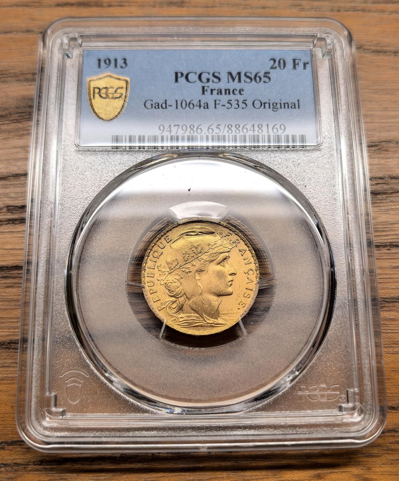 凡希社世界钱币微拍第三百零二期 1913法国自由帽女神20法郎金币PCGS-MS65，6.45g，900金。