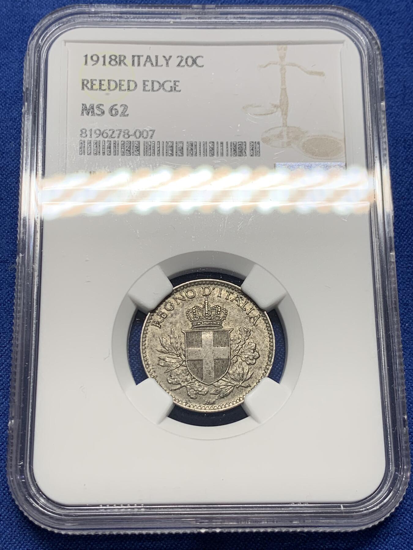 《竞宝斋》第377场 周日，周一 2场连拍 （全场包邮） NGC MS62 意大利1918年20分 使用王国时期的1894年版20分作币坯，可见币坯痕迹。1919年模具是光边，1894版是齿边，所以有些样本可见边齿，因此衍生出了两种版别。