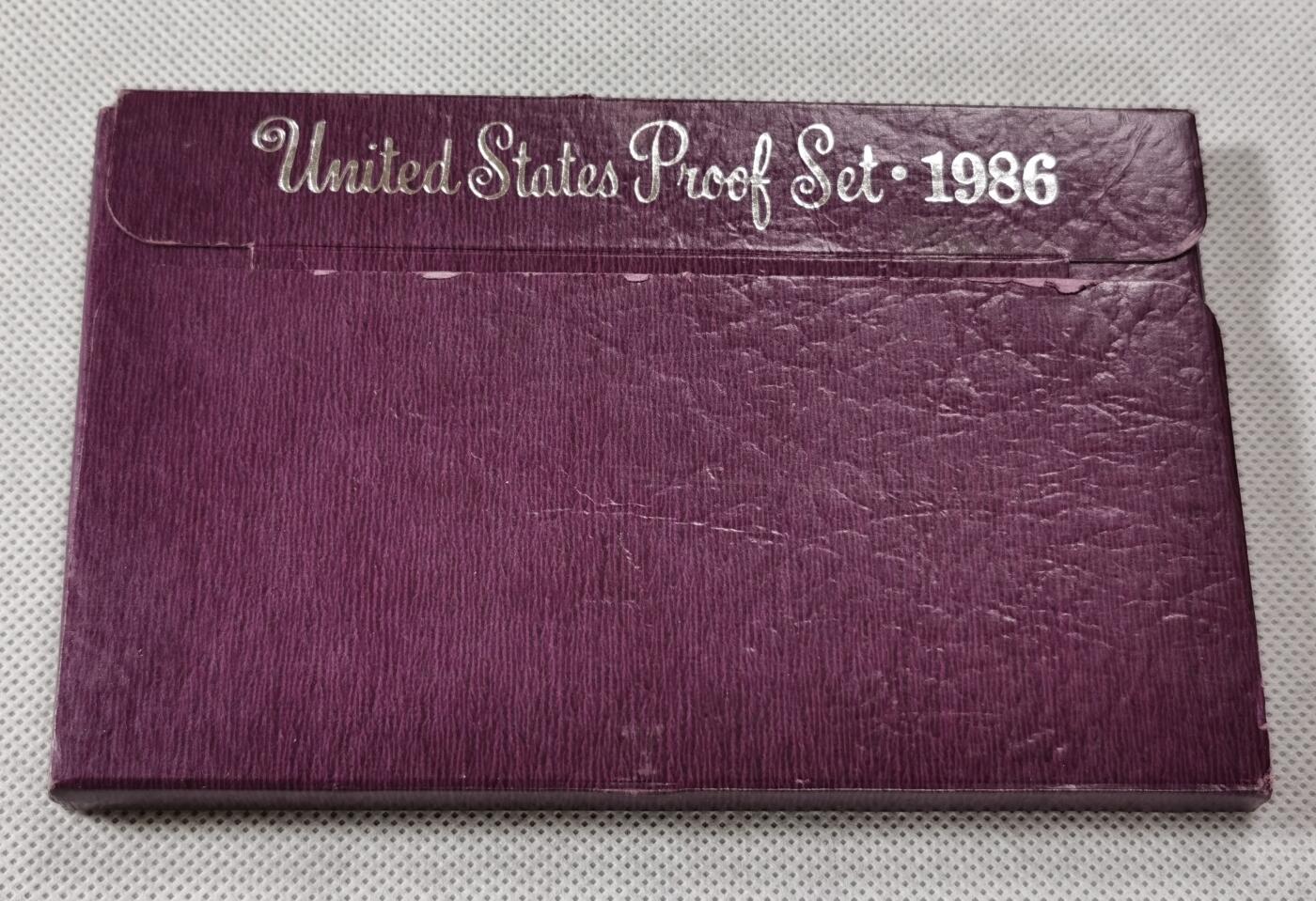  甄臻铺-世界币章拍卖（第15期）套币，现代银币专场。送拍享返佣金等优惠多多 美国1986年盒装精制套币，几乎未氧化