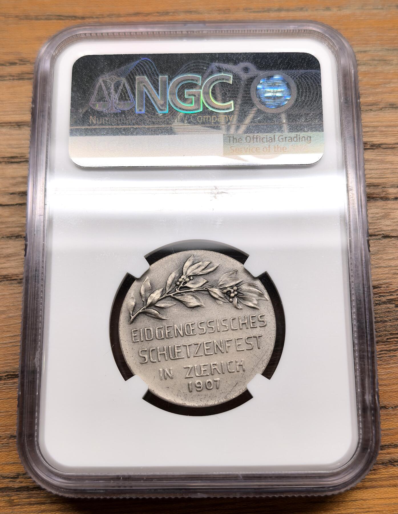 凡希社世界钱币微拍第三百零三期 1907瑞士苏黎世射击节纪念银章NGC-MS65，matte磨砂工艺，设计风格简练优雅，稀少品种，高分收藏级！