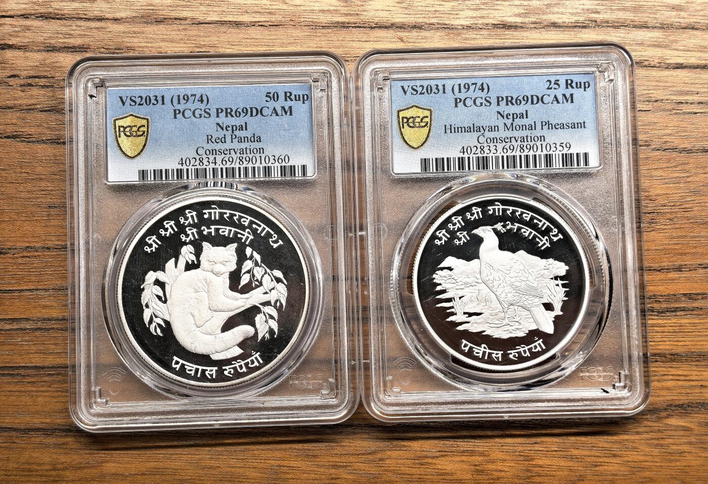 凡希社世界钱币微拍第三百零三期 1974不丹珍稀动物25/50卢比大银精铸两枚套PCGS-PF69DCAM，收藏级品质！