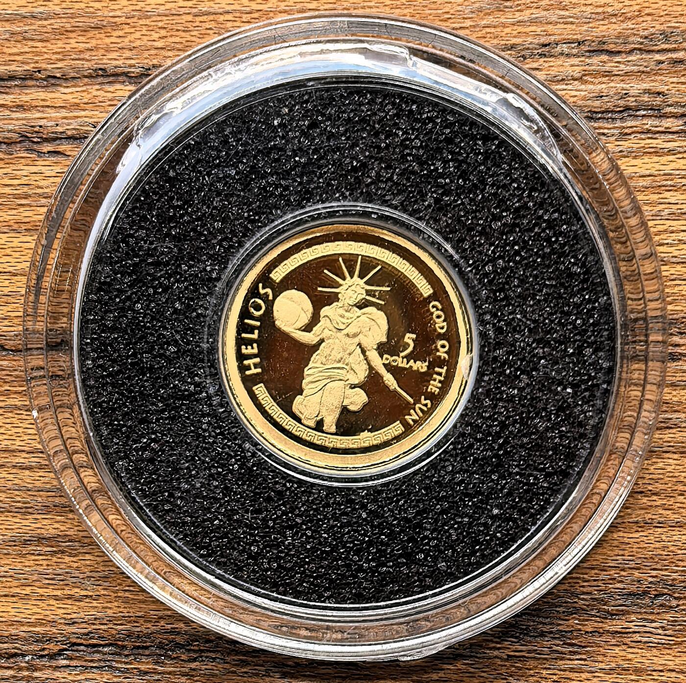 凡希社世界钱币微拍第三百零三期 2009库克群岛太阳神5元小金币全品，0.5g，999金
