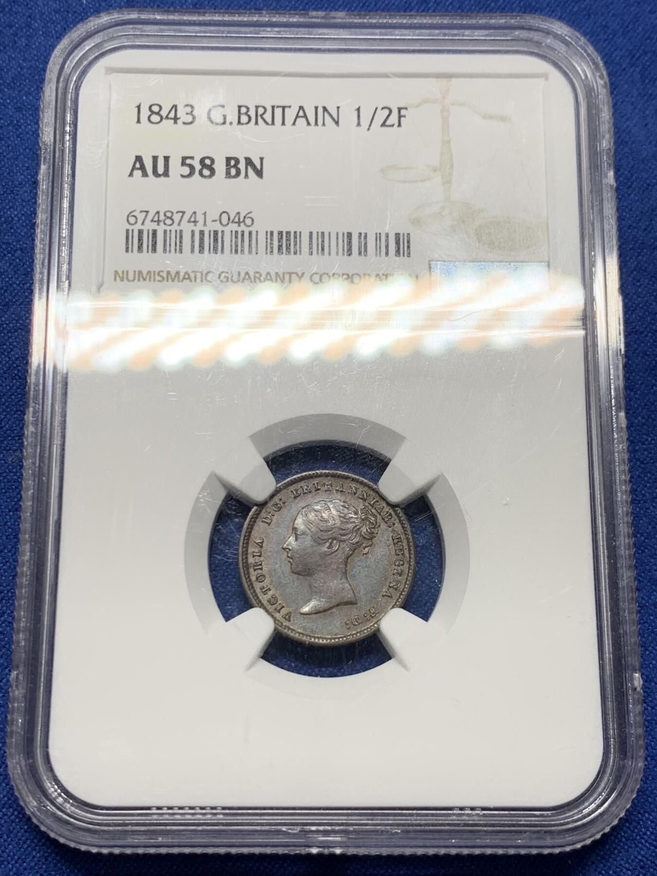 《竞宝斋》第382场 周日，周一，周二 3场连拍 （全场包邮） NGC AU58BN 英国 1843年 1/2法新 维多利亚年轻头像，极为稀少的高品相铜币，细节清晰，年轻女王的肖像依旧鲜明，金属光泽未曾褪色，岁月的痕迹轻柔地勾画出历史的轮廓
