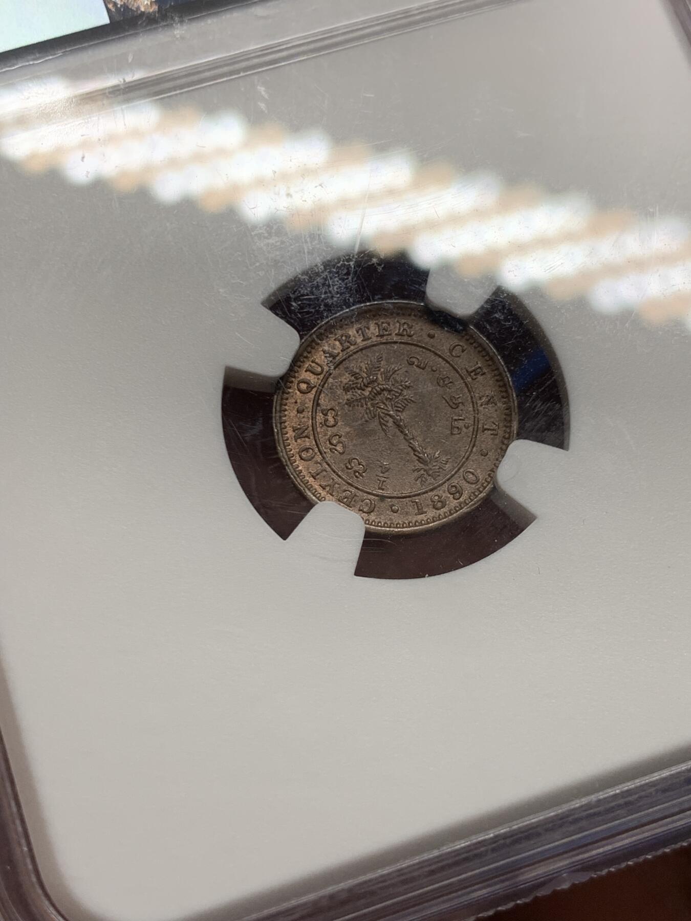 《竞宝斋》第383场 周日，周一，周二 3场连拍 （全场包邮） NGC MS64BN 锡兰（Ceylon）1890年 1/4仙 铜币 维多利亚女王左像，雕刻精致，红棕原色包浆温润。殖民地低面值小铜币，流通剧烈，存世高分尤为罕见。细节完整，静静承载着旧英属锡兰的殖民记忆与热带岛国的岁月余温
