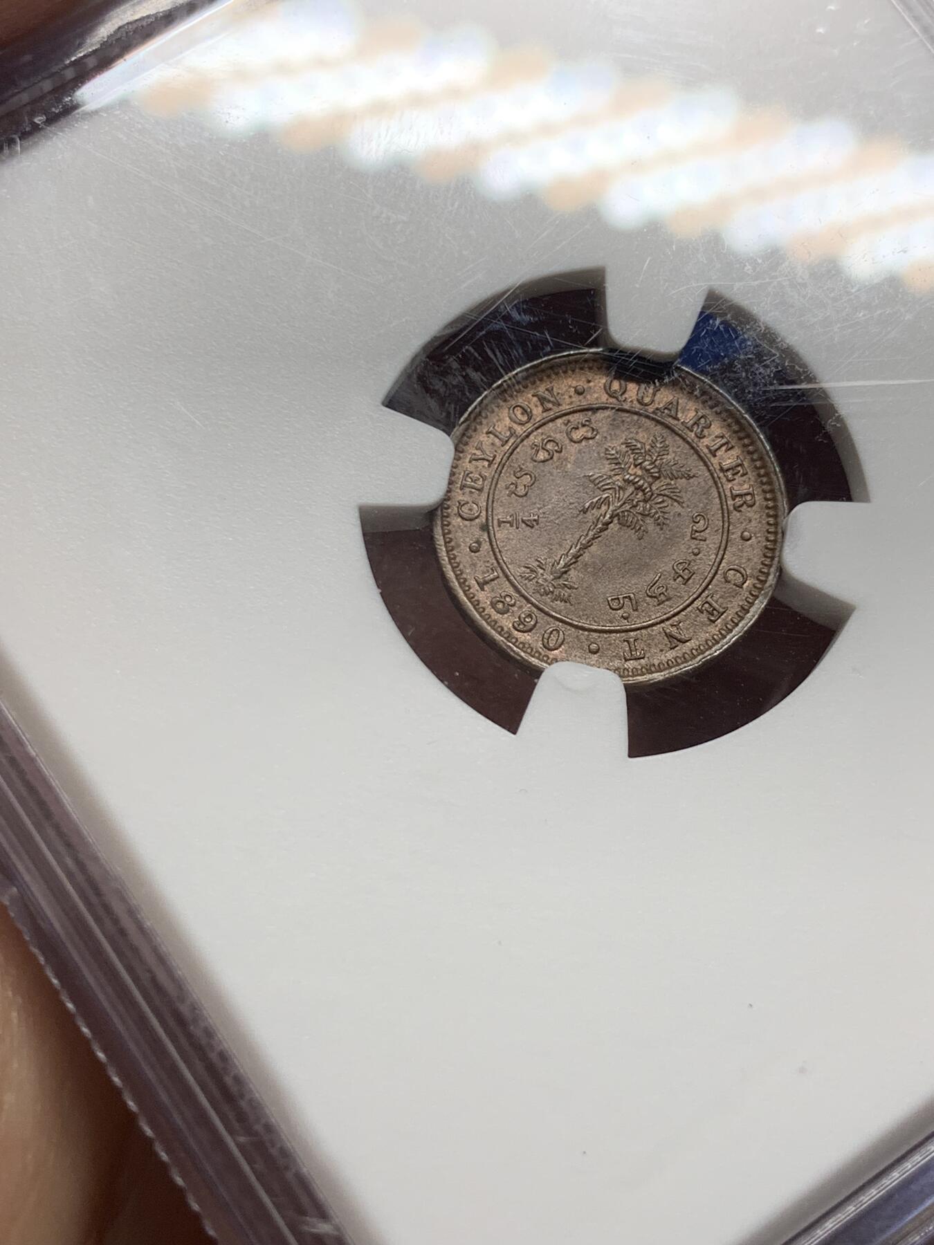 《竞宝斋》第383场 周日，周一，周二 3场连拍 （全场包邮） NGC MS64BN 锡兰（Ceylon）1890年 1/4仙 铜币 维多利亚女王左像，雕刻精致，红棕原色包浆温润。殖民地低面值小铜币，流通剧烈，存世高分尤为罕见。细节完整，静静承载着旧英属锡兰的殖民记忆与热带岛国的岁月余温