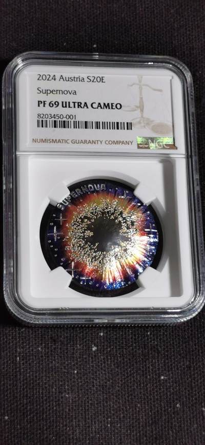 刘世昌艺术品销售中心～虎踞龙蟠*金杨在线联拍群第509期 - 奥地利2024年“宇宙之美～超新星”20欧彩色凹面精制纪念银币（NGC    PF69UC    串号：8203450-001）1枚，原盒证。此币荣获今年“克劳斯世界硬币大奖赛～最佳硬币和最佳艺术币”两项大奖。