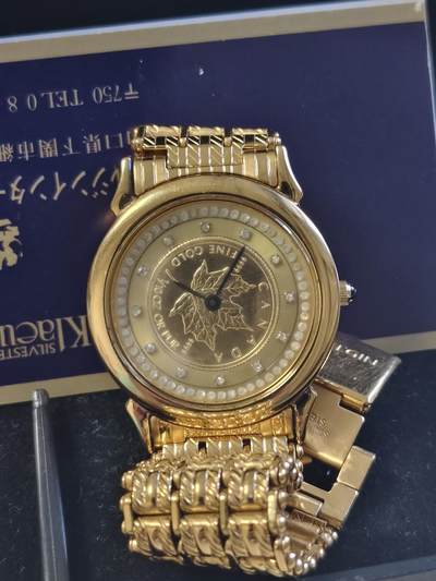 第161期拍卖【长期征集拍品】 - 加拿大90年代1/10盎司枫叶纯金金币女式石英手表，表盘镶嵌钻石。表带为合金，后盖材质为925银，走时正常但需要去表店更换电池，金价大致2495左右