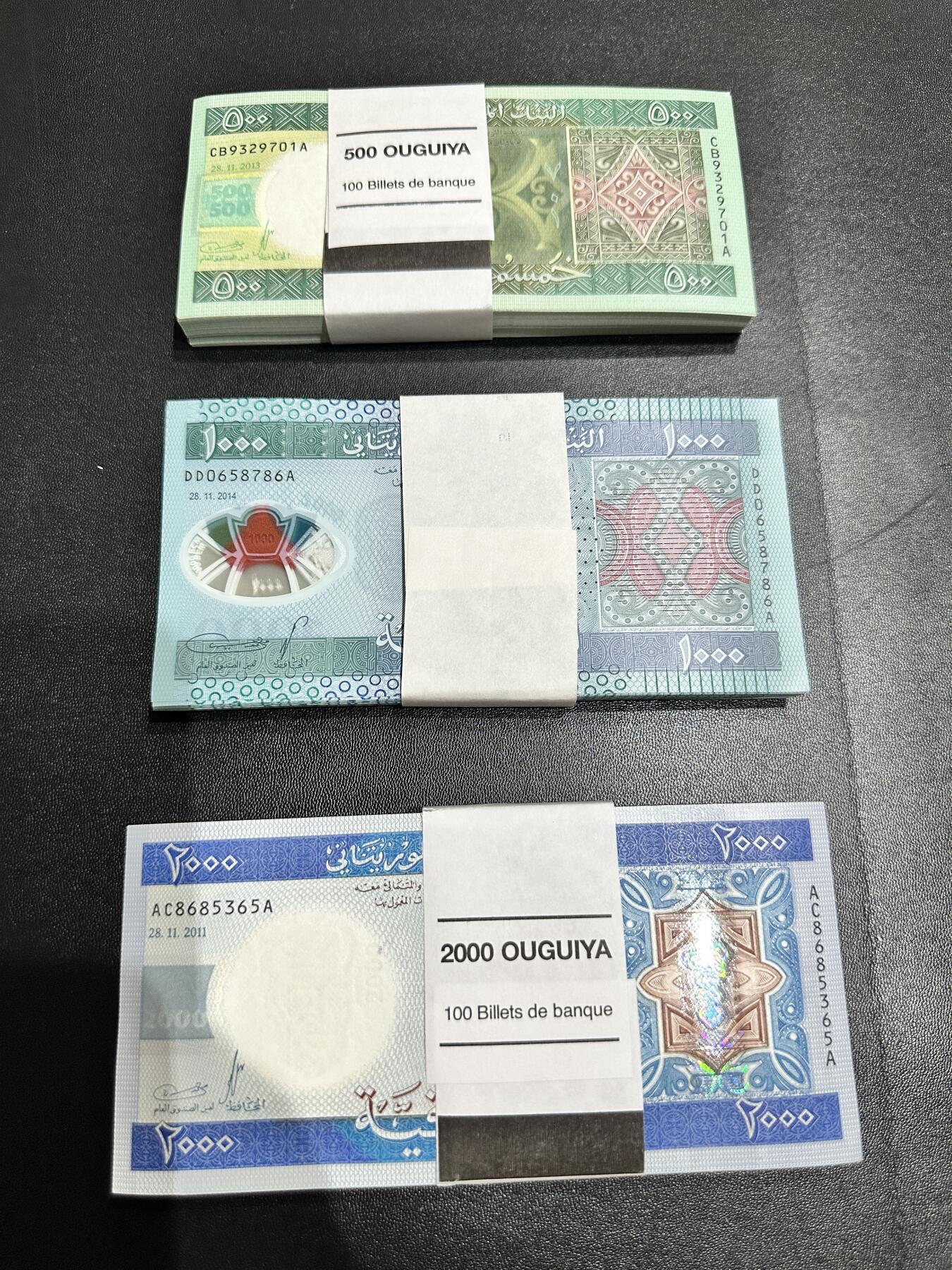 《外钞收藏家》第五百三十八期（本期有精美裸币、稀少美元、精美法属）（本平台长期征集拍品、欢迎藏友们联系合作） 毛里塔尼亚500、1000、2000新版三个面额 每个面额87张 全新
