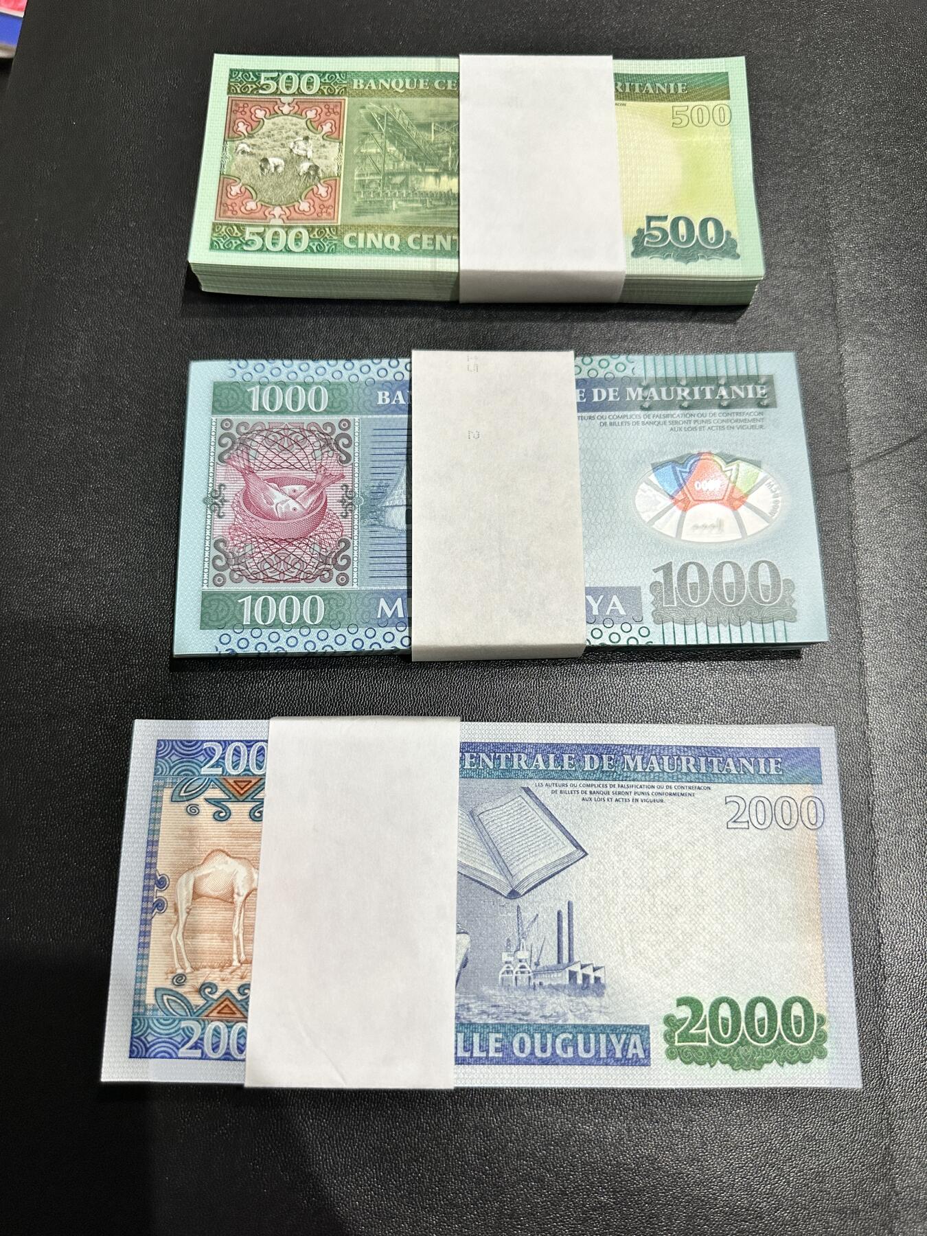 《外钞收藏家》第五百三十八期（本期有精美裸币、稀少美元、精美法属）（本平台长期征集拍品、欢迎藏友们联系合作） 毛里塔尼亚500、1000、2000新版三个面额 每个面额87张 全新