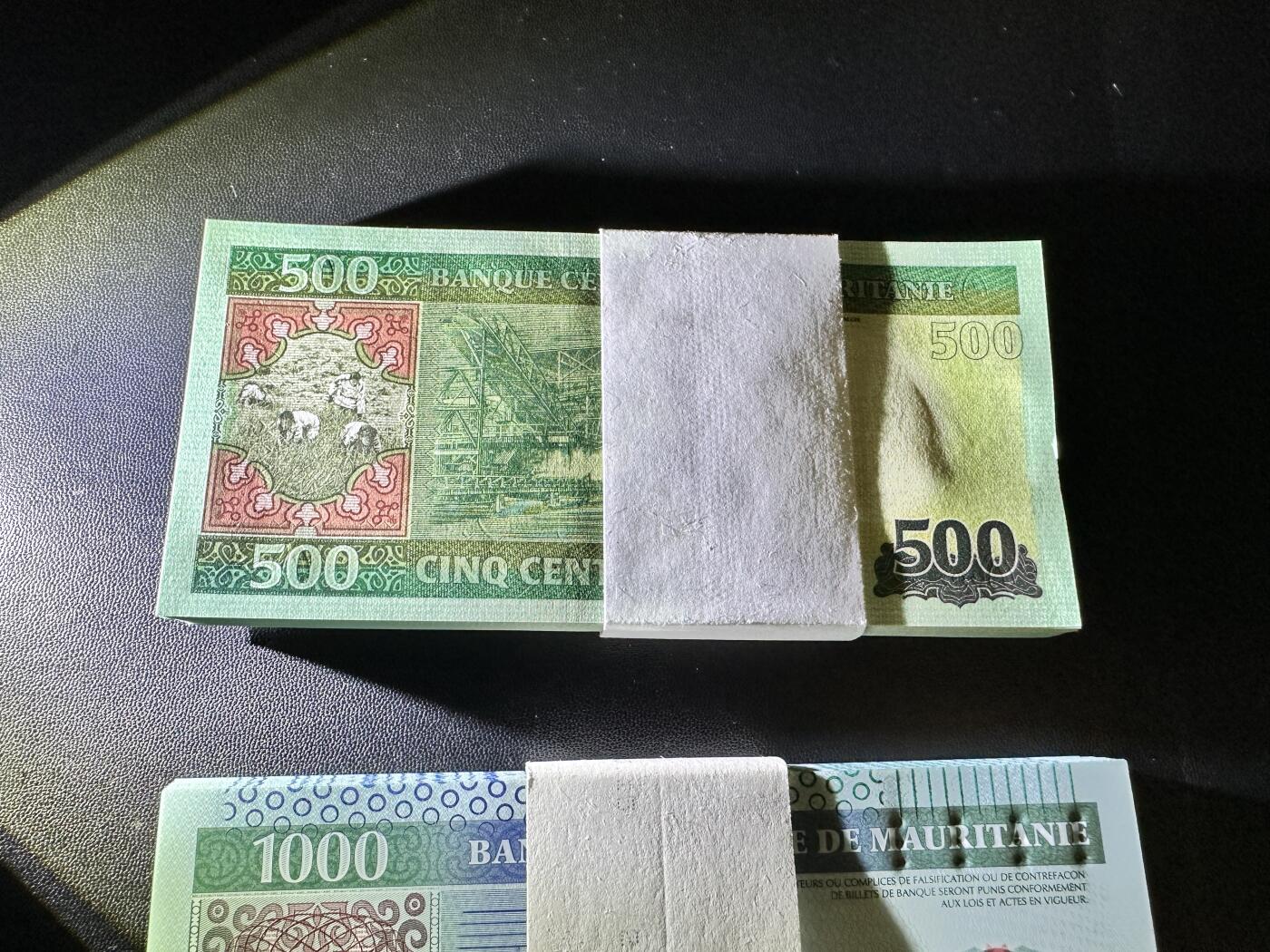 《外钞收藏家》第五百三十八期（本期有精美裸币、稀少美元、精美法属）（本平台长期征集拍品、欢迎藏友们联系合作） 毛里塔尼亚500、1000、2000新版三个面额 每个面额87张 全新