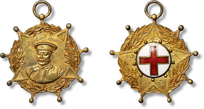 上海匡时2025年春季拍卖会 民国黎元洪戎装像背红十字武汉纪念章一枚，纪念章为金色，星形此章颁发给 武汉辛亥革命参与救护伤员有功劳绩者所佩戴，正面正中白底圆版，饰红十字会图案，其外一周镌“武汉纪念章”字样；背面正中为黎元洪戎装浮雕胸像，像上方镌黎元洪英文姓名（镀金）。整枚纪念章为十八星图案，四缘浮雕以三层橄榄叶。制作极为精美 原色包浆，品相一流