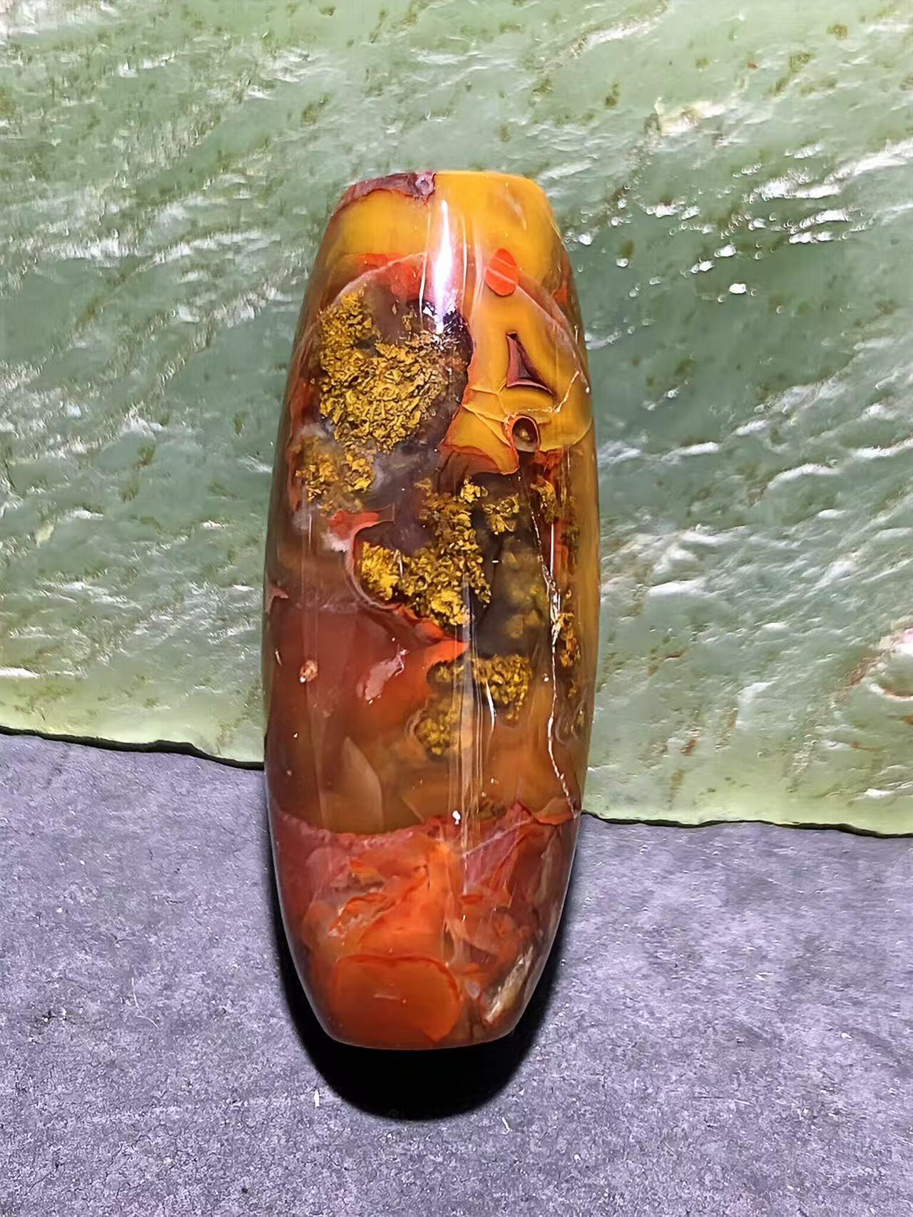冻料草花纹战国红玛瑙天珠形通货桶珠一个，