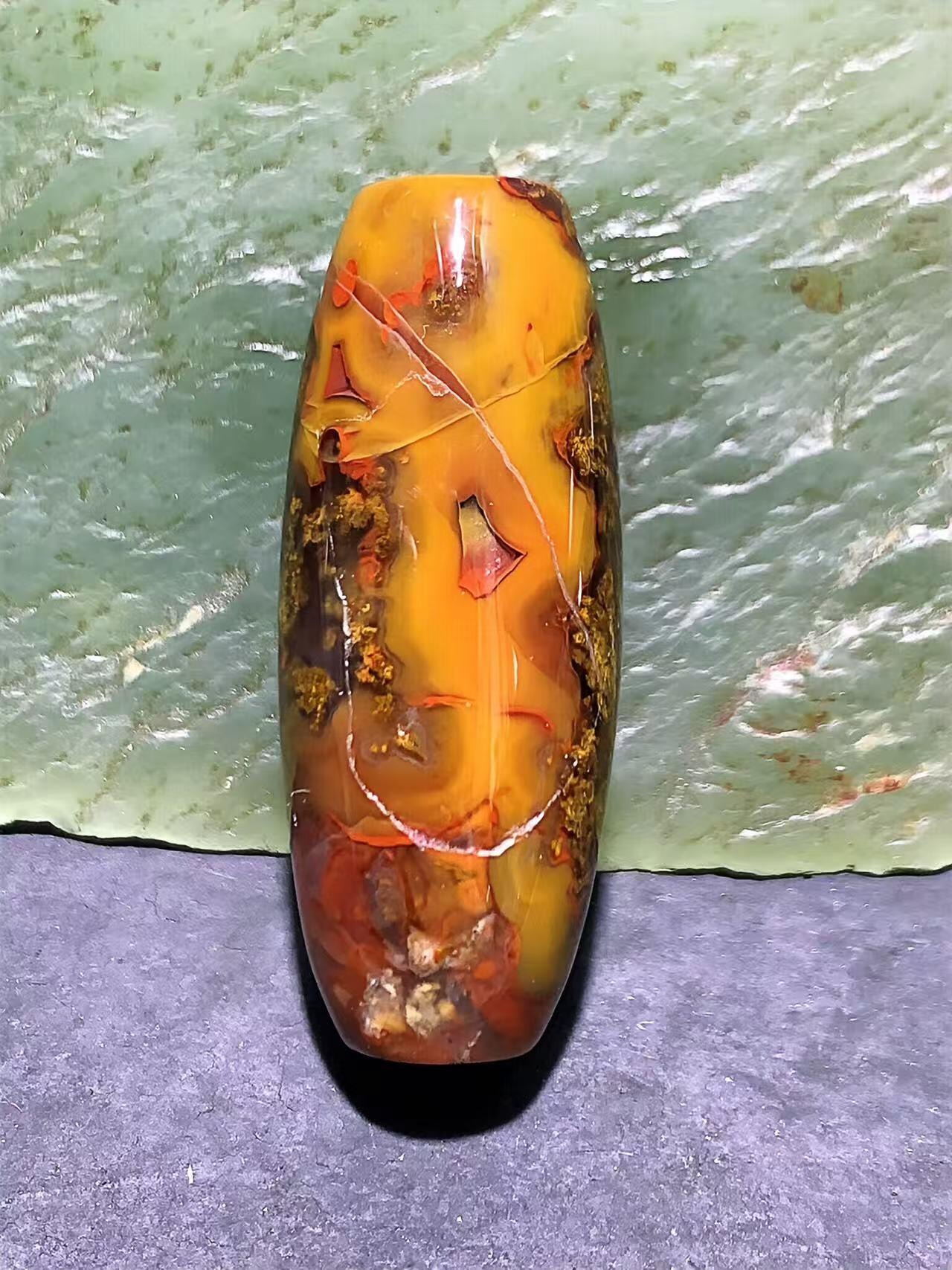 冻料草花纹战国红玛瑙天珠形通货桶珠一个，