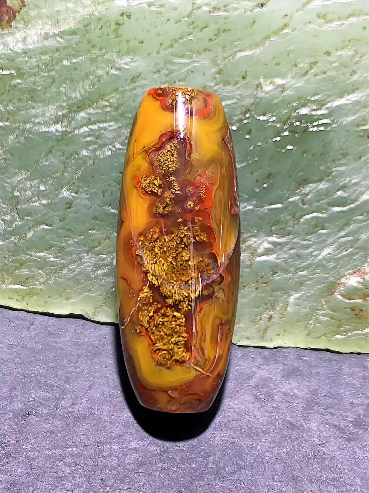 冻料草花纹战国红玛瑙天珠形通货桶珠一个，