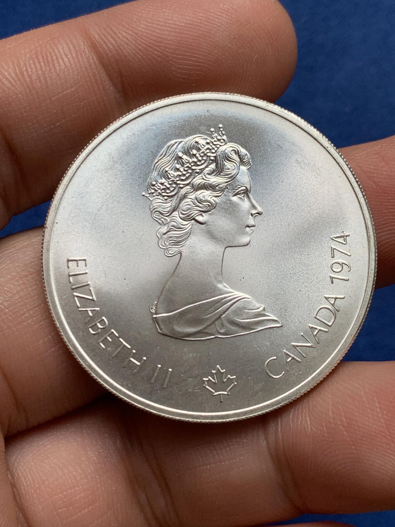 《竞宝斋》第396场 周日，周一，2场连拍 （全场包邮） 加拿大1976年蒙特利尔夏季奥运会-手持火炬的运动员银币 925银 24.3克