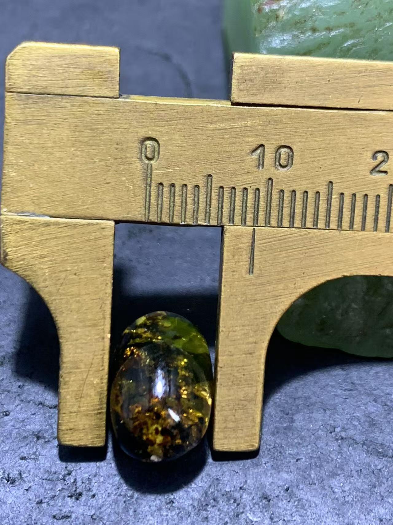 精美乌克兰花珀枣形桶珠一个