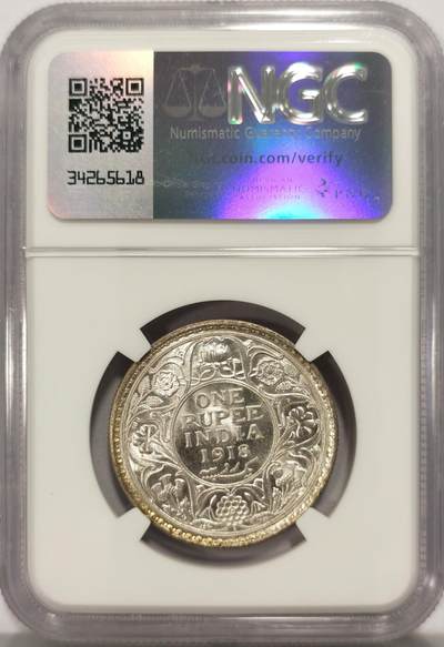博洋堂世界钱币拍卖第129期（全场包邮） NGC MS63 英属印度1918年乔治五世1卢比银币 正面黄油光向橘黄色渐变，背面浅包浆银霜漂亮。达到63分的卢比就已经迈入大众好品相的标准了，划痕对于62分会少很多，加之来自库存品相完全未流通的出厂品相，光度会特别好。
