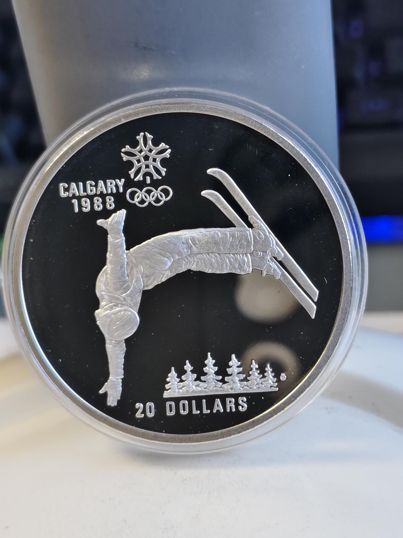 第165期拍卖【长期征集拍品】 加拿大1986年卡尔加里奥运会滑雪纪念银币，925银，34.107克，银价267.5
