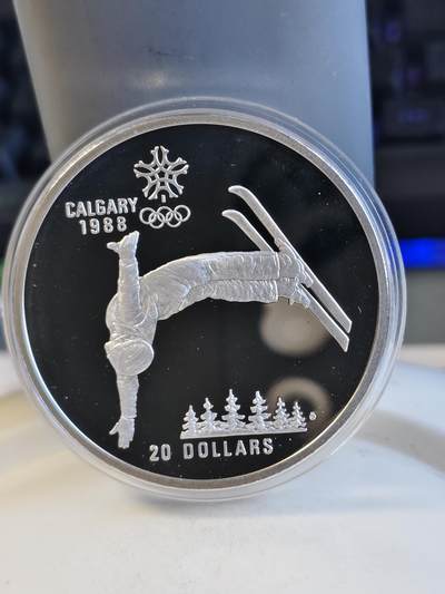 第165期拍卖【长期征集拍品】 - 加拿大1986年卡尔加里奥运会滑雪纪念银币，925银，34.107克，银价267.5