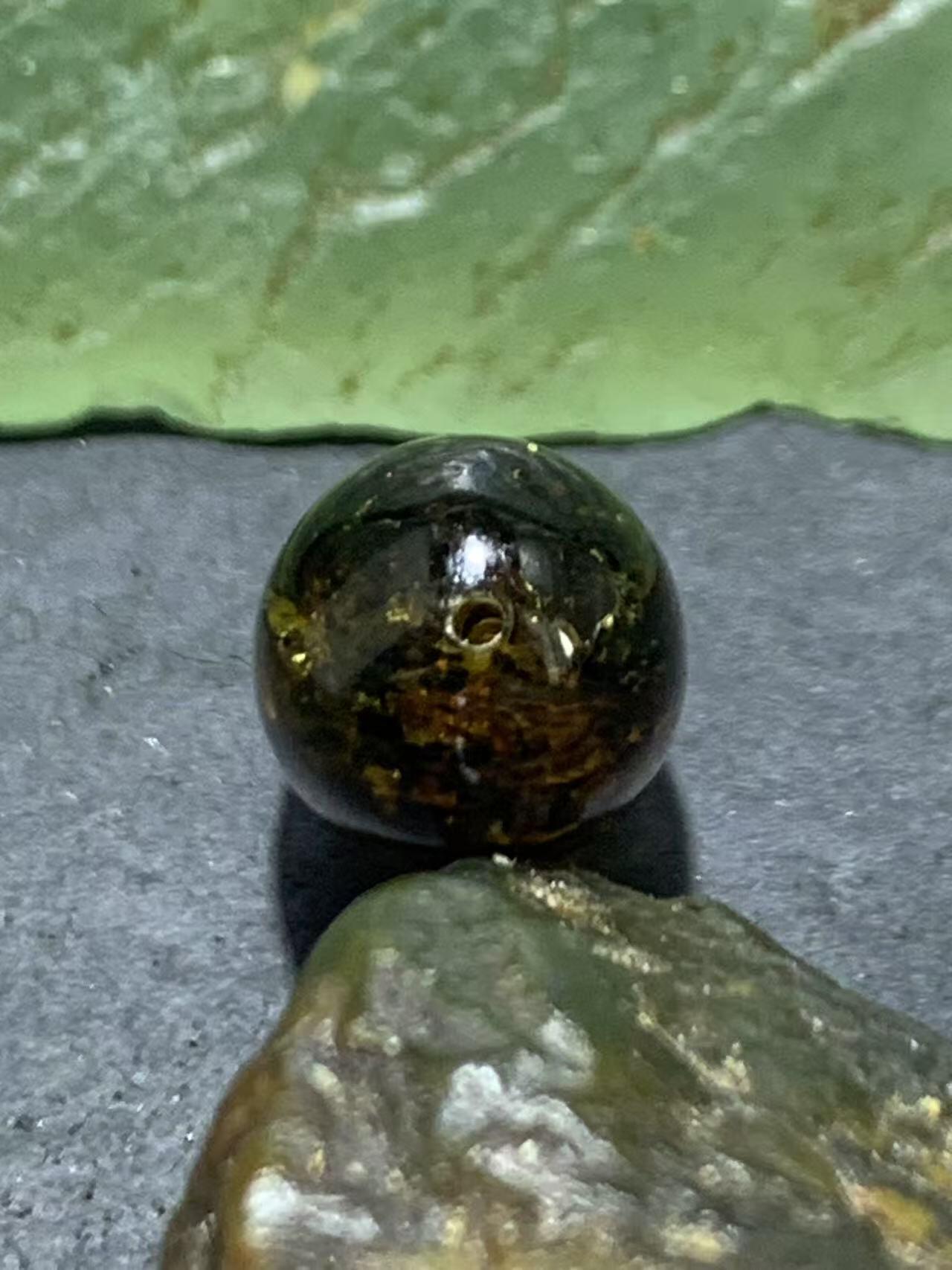 精美乌克兰花珀枣形桶珠一个