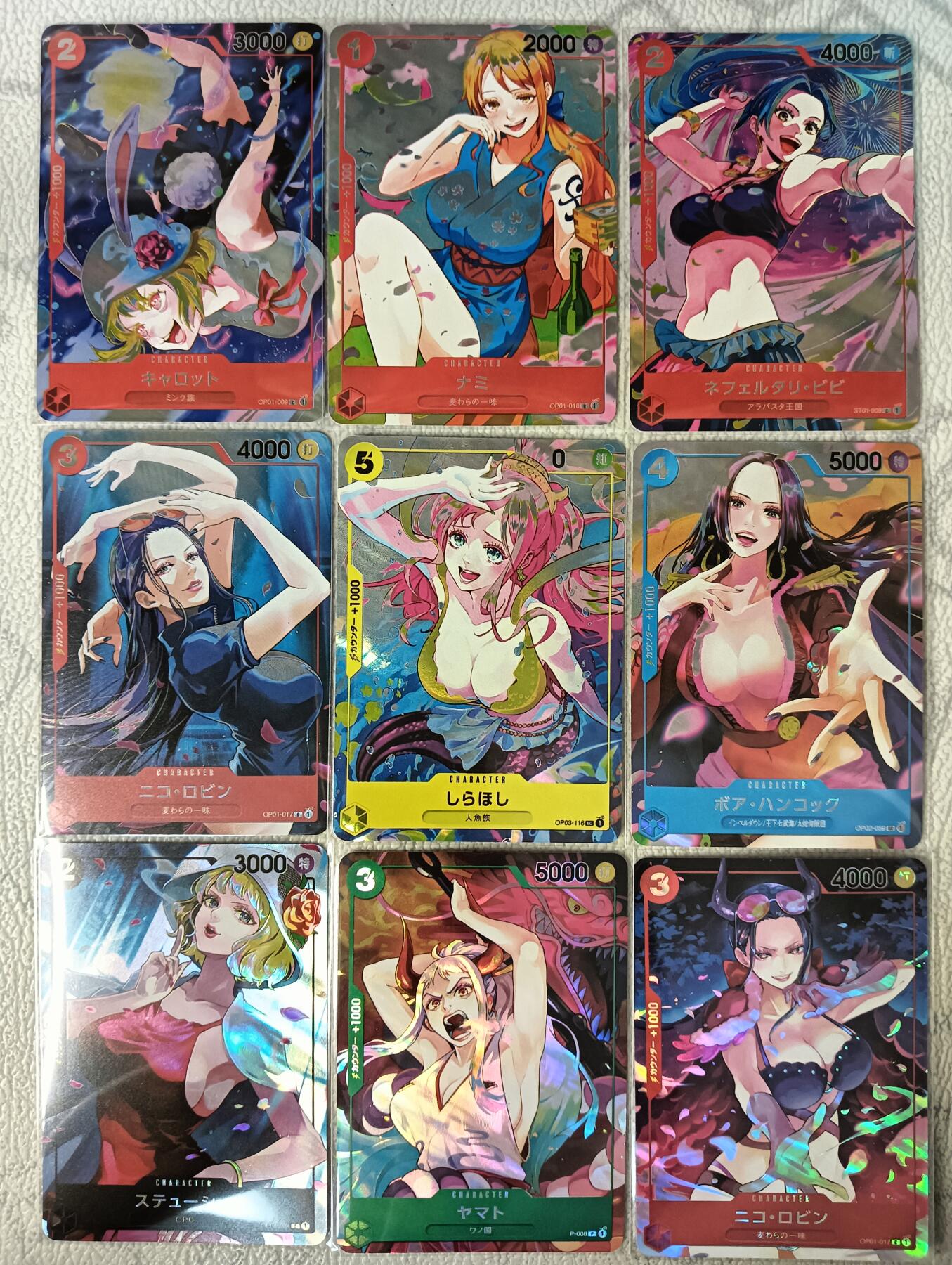 花开卡拍第29期（品控勿拍!!!拍品不寄存，运费5元，自制卡难免瑕疵，可能存在轻微撞角爆边等出厂瑕疵，品控介意勿拍！） 驴打滚卡牌 海贼王一套9张 斜纹折光彩闪 都是女卡 画风轻盈活泼