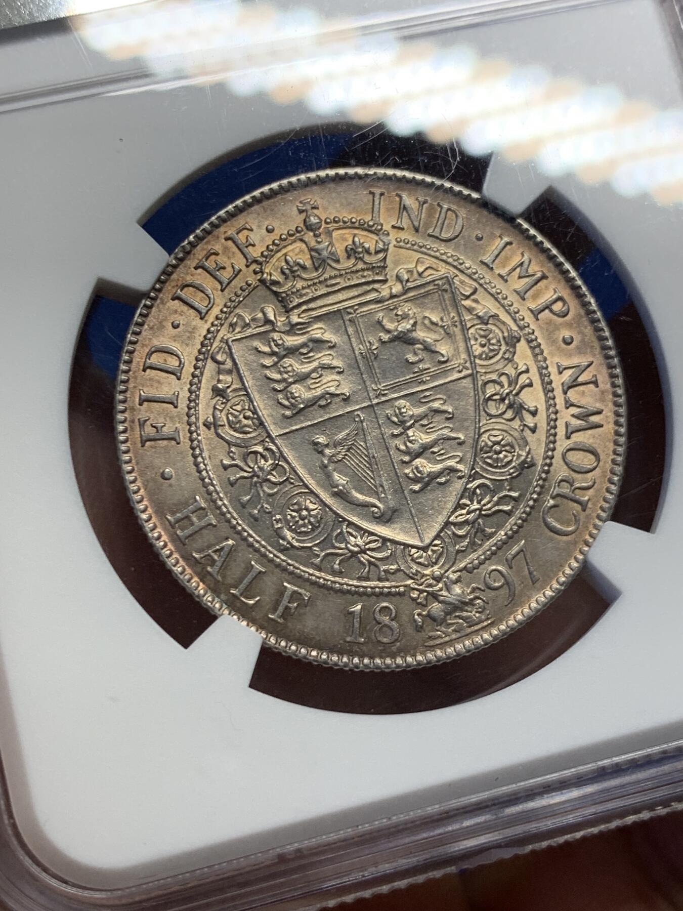 《竞宝斋》第398场 周日，周一，2场连拍 （全场包邮） NGC UNC 英国1897年维多利亚披纱半克朗银币 五彩包浆 细节极好