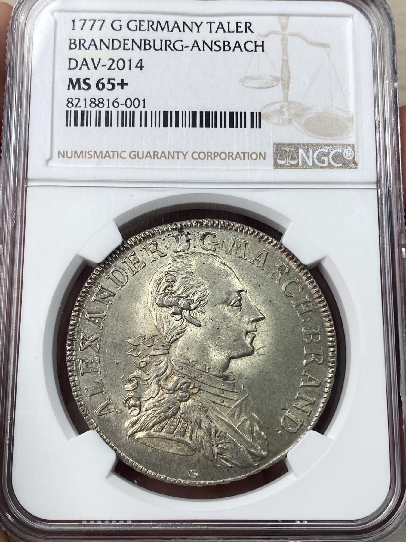 万国钱币拍卖第049期（万国夏季大拍） NGC MS65+ 1777德国勃兰登堡-安斯巴赫亚历山大亲王纹章泰勒 施瓦巴赫造币厂铸造 拥有着极其华丽纹章的一枚大规格十八世纪小邦泰勒 历经两百余年时光洗礼依旧完美保持了其出厂时的全原光状态 上手绝对震撼的一枚 NGC唯一冠军分 独孤求败的王者品相
