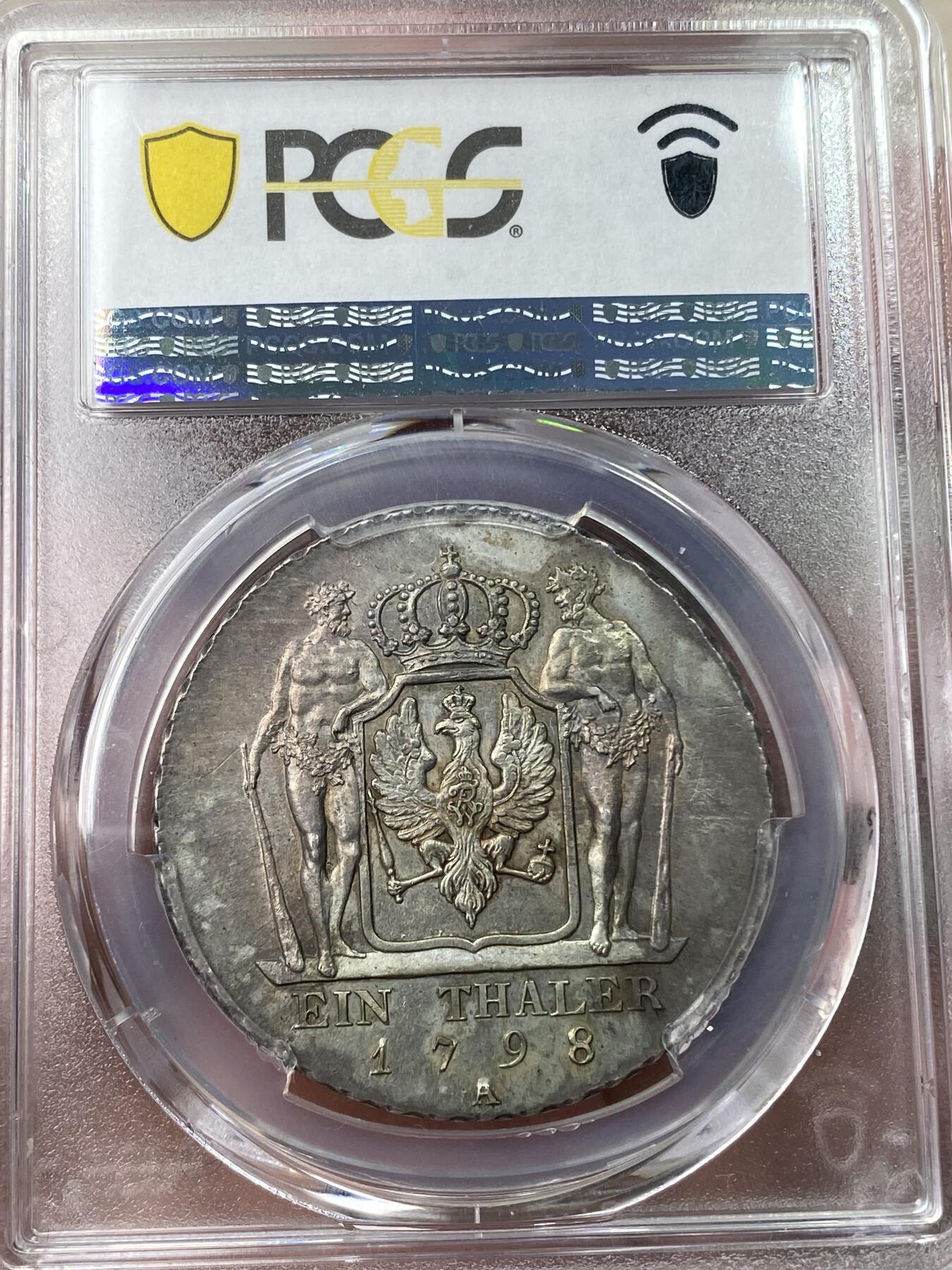 万国钱币拍卖第049期（万国夏季大拍） PCGS MS64 1798年德国普鲁士威廉三世野人护盾流通1泰勒 普鲁士名品之一 均匀德系淡彩 全深打高点极佳 绝对的收藏级品质 PC冠军分