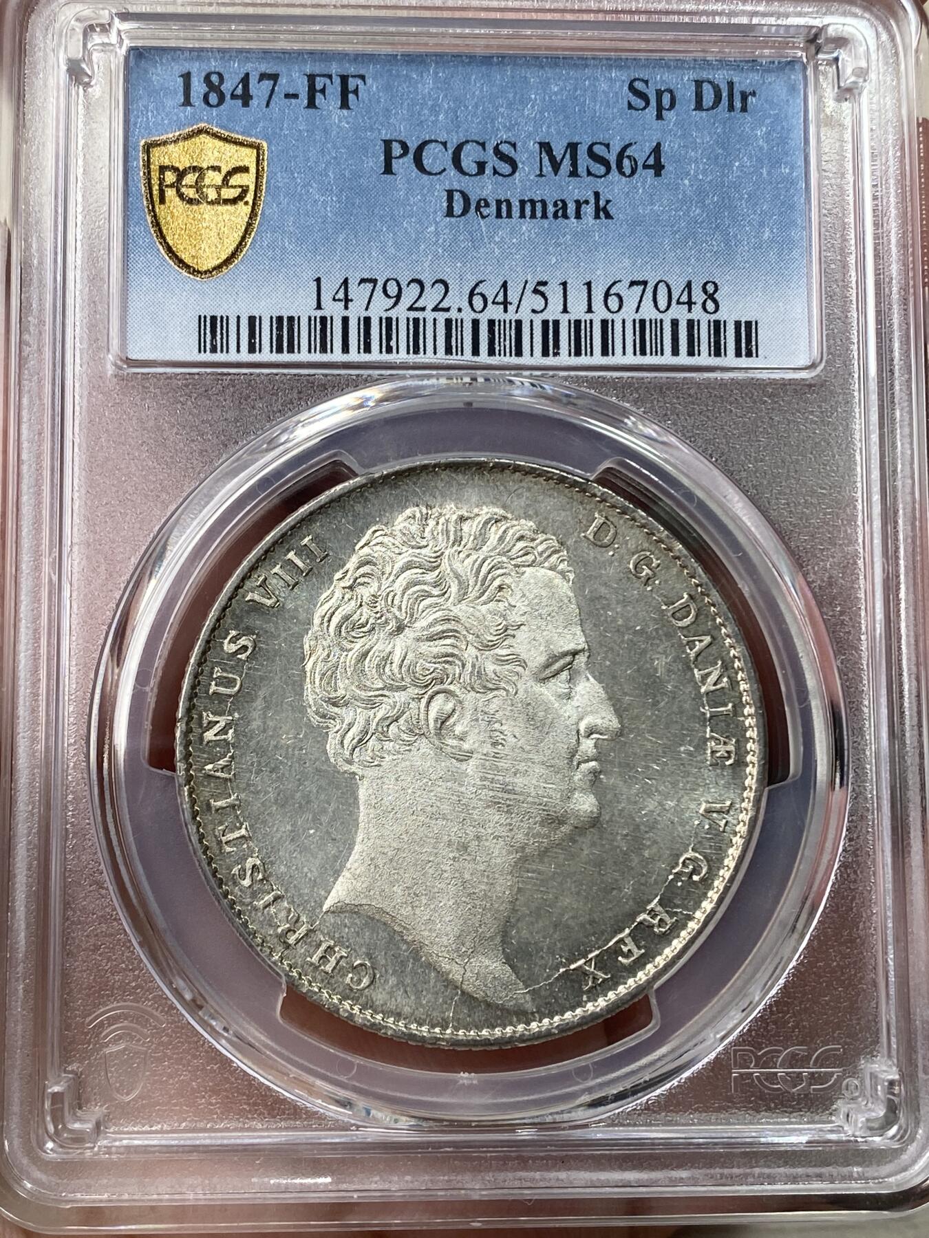 万国钱币拍卖第049期（万国夏季大拍） PCGS MS64 1847丹麦克里斯蒂安八世野人护盾达勒 设计非常出彩的一款北欧大银 野人纹章兼具了观赏性和趣味性 人像喷砂底板类镜面质感 PC唯一冠军。