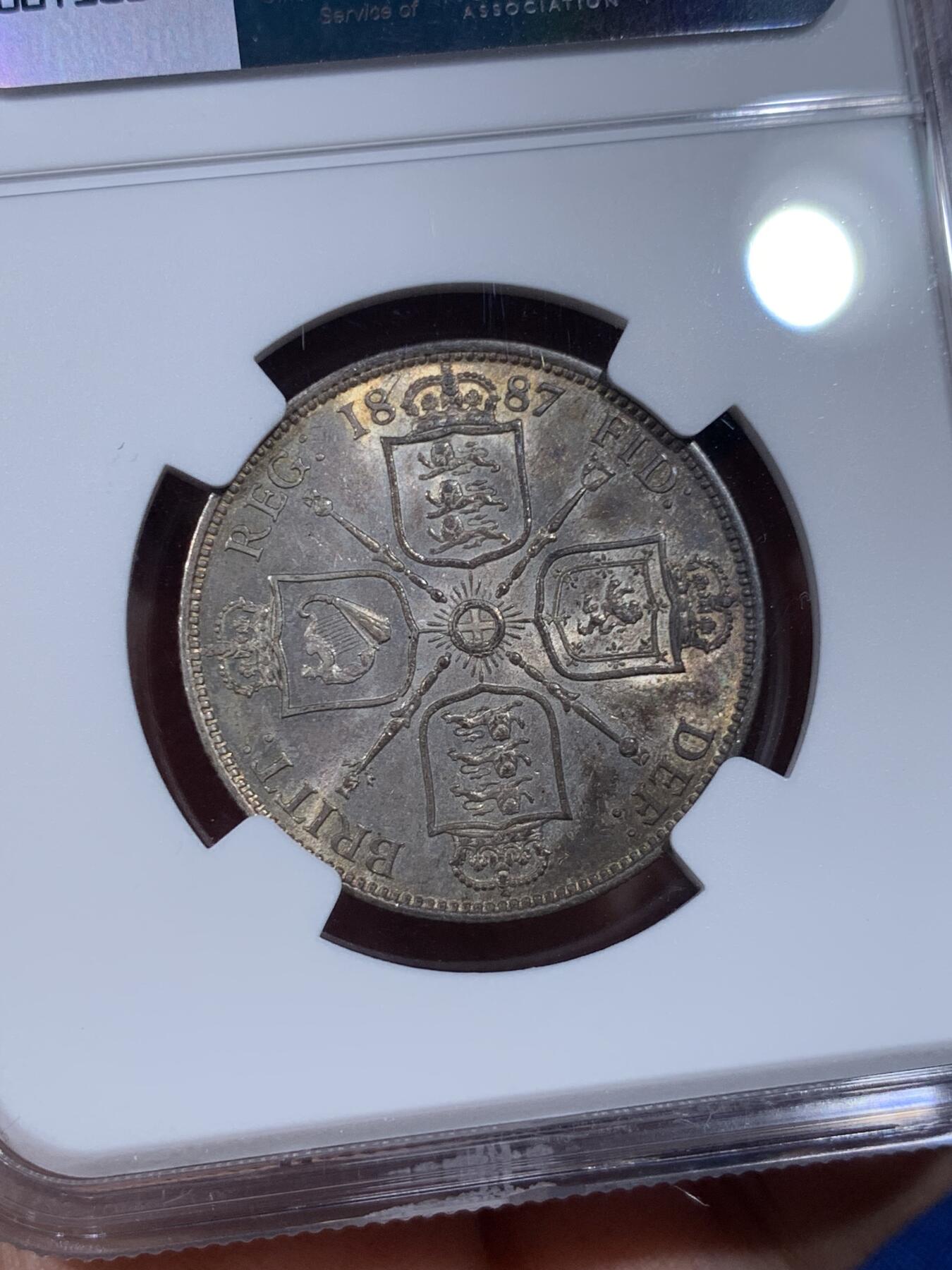 《竞宝斋》第398场 周日，周一，2场连拍 （全场包邮） NGC MS61 英国1887维多利亚弗洛林，正面五彩月牙包浆，带银霜，背面黑彩，正反相得益彰，宛若天边一抹晚霞绚丽