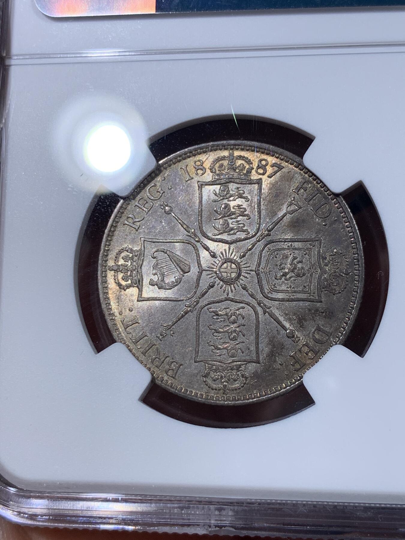 《竞宝斋》第398场 周日，周一，2场连拍 （全场包邮） NGC MS61 英国1887维多利亚弗洛林，正面五彩月牙包浆，带银霜，背面黑彩，正反相得益彰，宛若天边一抹晚霞绚丽
