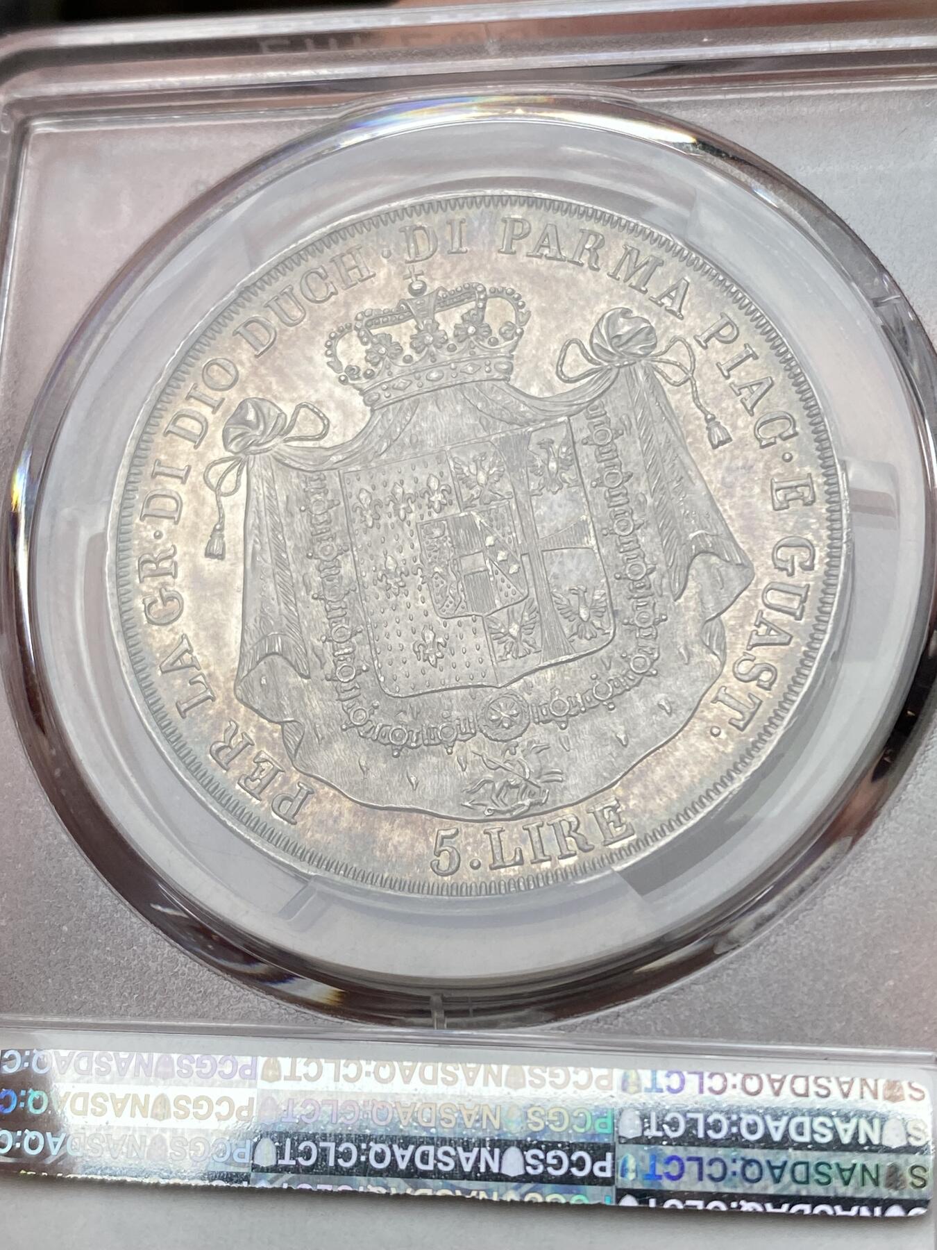 万国钱币拍卖第049期（万国夏季大拍） PCGS MS63PL 1815意大利帕尔马5里拉银币 正面帕尔马女大公是拿皇的妻子玛丽亚·路易斯，背面帕尔马纹章繁复华丽，好品极其难得的意系大银，国际市场广受欢迎品种，获得PL评分的更是凤毛麟角，均匀一色的玫瑰彩包浆搭配类镜面质感的底板，典藏级品质。