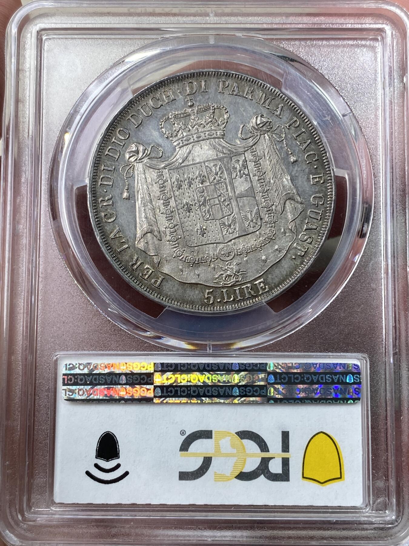 万国钱币拍卖第049期（万国夏季大拍） PCGS MS63PL 1815意大利帕尔马5里拉银币 正面帕尔马女大公是拿皇的妻子玛丽亚·路易斯，背面帕尔马纹章繁复华丽，好品极其难得的意系大银，国际市场广受欢迎品种，获得PL评分的更是凤毛麟角，均匀一色的玫瑰彩包浆搭配类镜面质感的底板，典藏级品质。