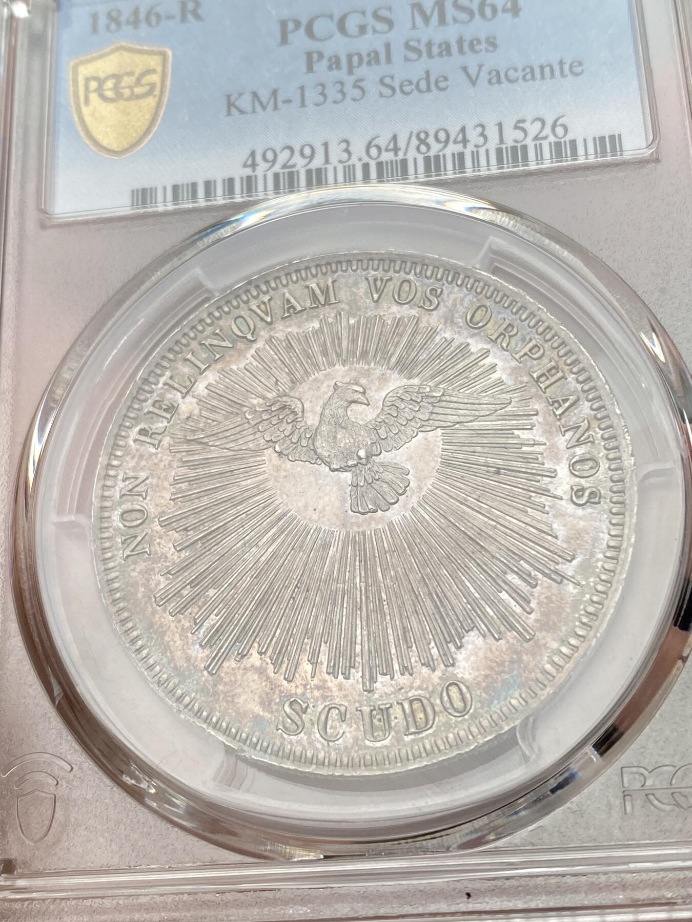 万国钱币拍卖第049期（万国夏季大拍） PCGS MS64 NGC MS64 1846年教皇国教宗缺位斯库多大银 罗马厂铸造，单年发行4000枚，无论是打制还是包浆都非常到位的一枚，类镜面五彩，PC亚军分，更高分仅一枚，典藏级品质。上个月NAC一枚63分到手约人民币1.9万。