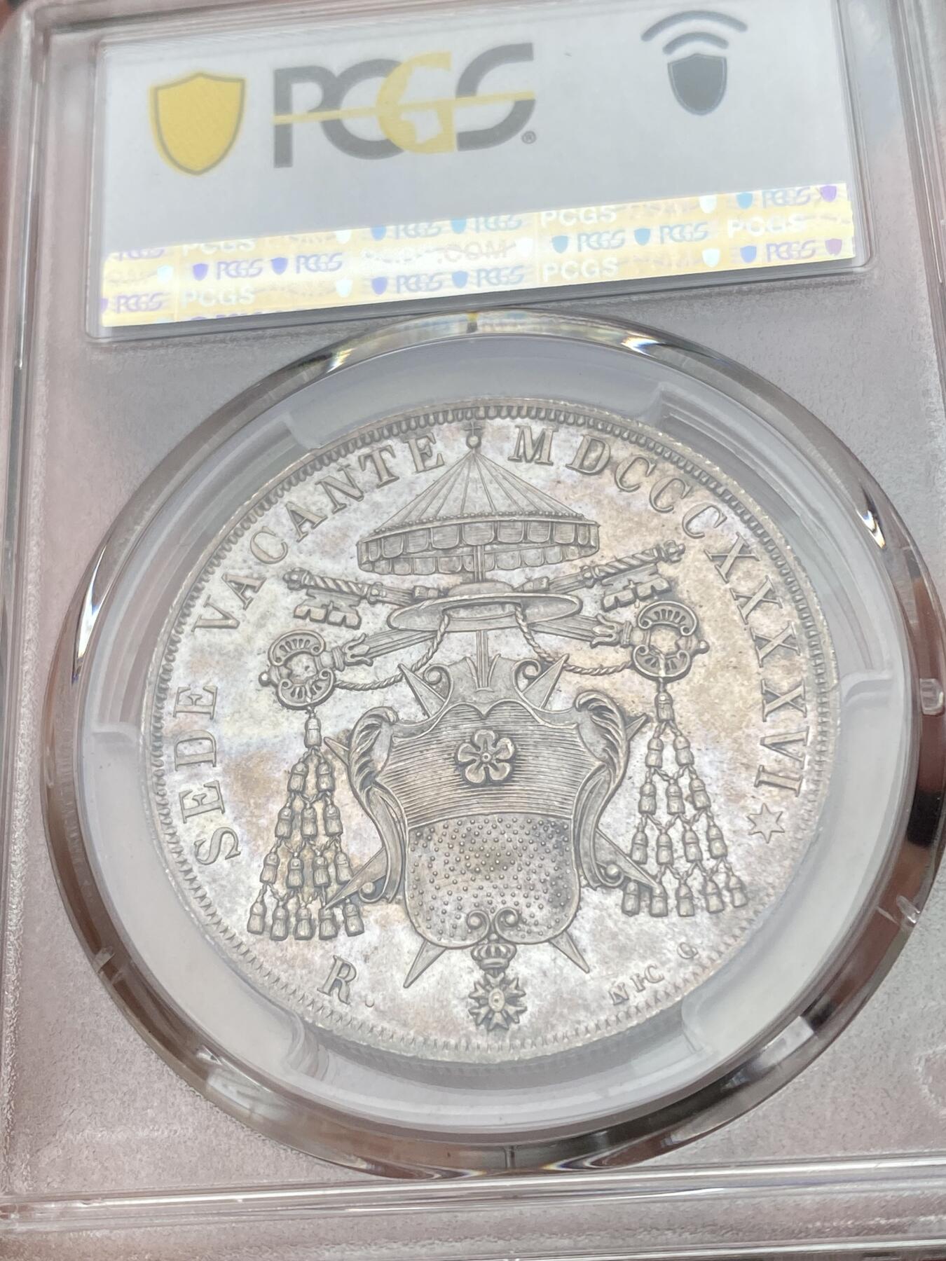 万国钱币拍卖第049期（万国夏季大拍） PCGS MS64 NGC MS64 1846年教皇国教宗缺位斯库多大银 罗马厂铸造，单年发行4000枚，无论是打制还是包浆都非常到位的一枚，类镜面五彩，PC亚军分，更高分仅一枚，典藏级品质。上个月NAC一枚63分到手约人民币1.9万。