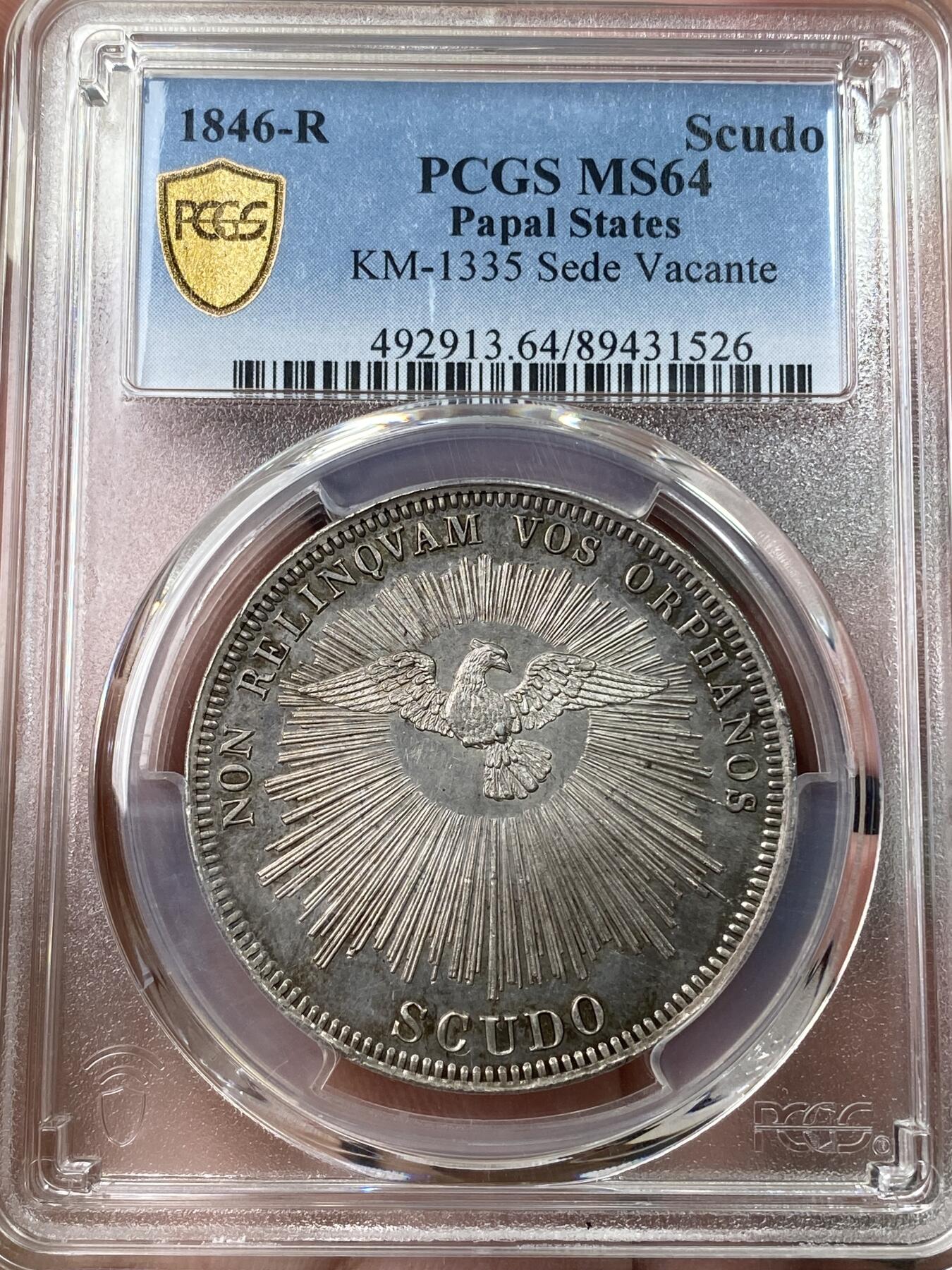 万国钱币拍卖第049期（万国夏季大拍） PCGS MS64 NGC MS64 1846年教皇国教宗缺位斯库多大银 罗马厂铸造，单年发行4000枚，无论是打制还是包浆都非常到位的一枚，类镜面五彩，PC亚军分，更高分仅一枚，典藏级品质。上个月NAC一枚63分到手约人民币1.9万。