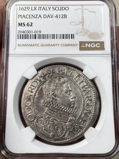 万国钱币拍卖第049期（万国夏季大拍） - NGC MS62 意大利1629年法尔内塞家族SCUDO大银币 皮亚琴察铸。正面为穿着戎装的奥多阿尔多一世·法尔内塞，背面为雇佣兵打扮的守护圣人，将守护圣人极度世俗化，受到了家族成员和民众的推崇，导致流通非常充足，连博物馆都见不到品相完美的样本。此枚包浆均匀，底光犹存，NGC最高分，极其难得的一枚意系藏品。