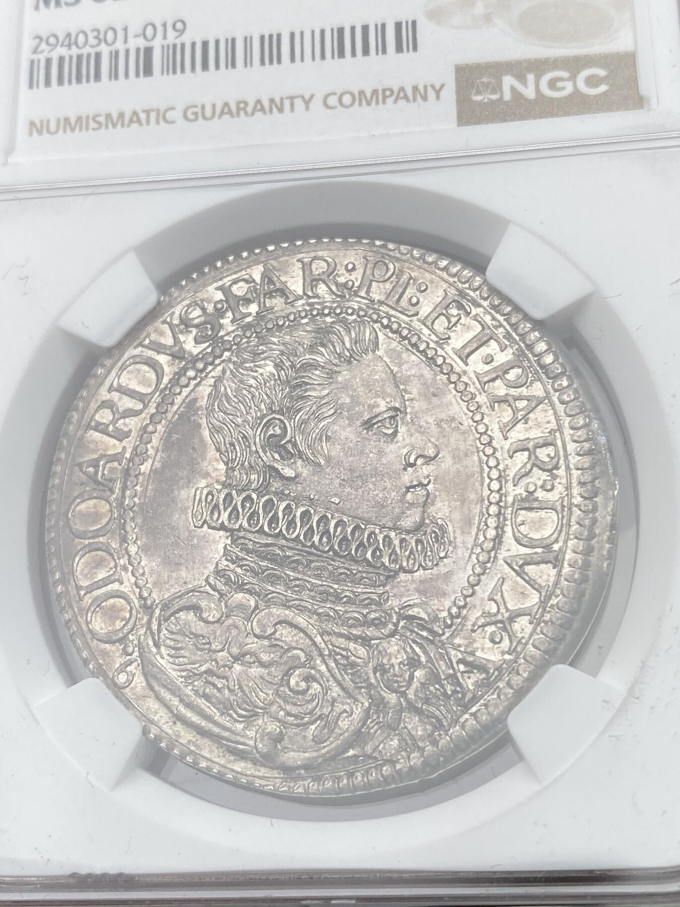 万国钱币拍卖第049期（万国夏季大拍） NGC MS62 意大利1629年法尔内塞家族SCUDO大银币 皮亚琴察铸。正面为穿着戎装的奥多阿尔多一世·法尔内塞，背面为雇佣兵打扮的守护圣人，将守护圣人极度世俗化，受到了家族成员和民众的推崇，导致流通非常充足，连博物馆都见不到品相完美的样本。此枚包浆均匀，底光犹存，NGC最高分，极其难得的一枚意系藏品。