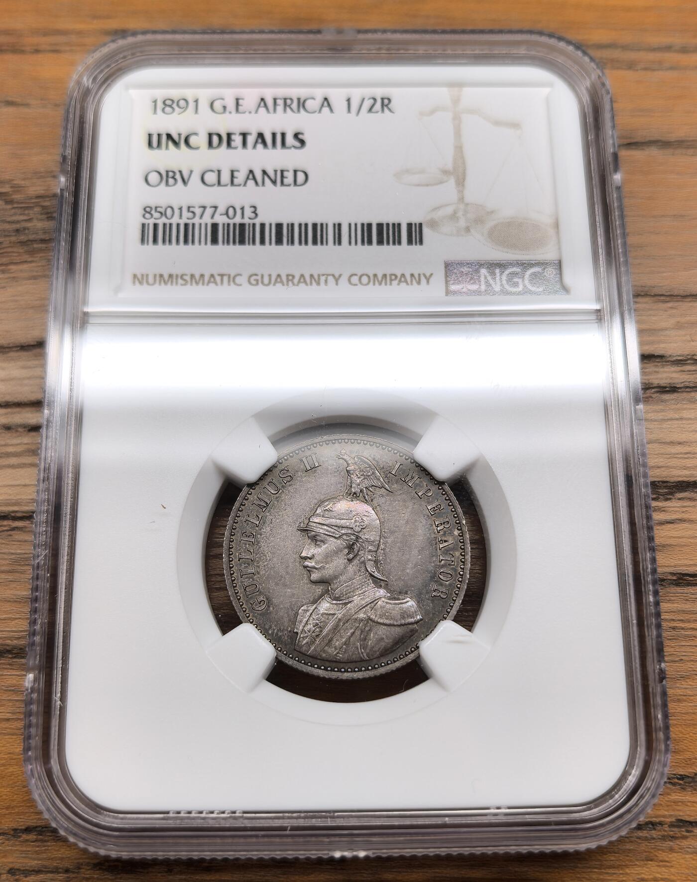 凡希社世界钱币微拍第三百零七期 1891德国东非公司1/2卢比银币NGC-UNCD，灰彩，实物状态相当好，全套最稀少的面值。