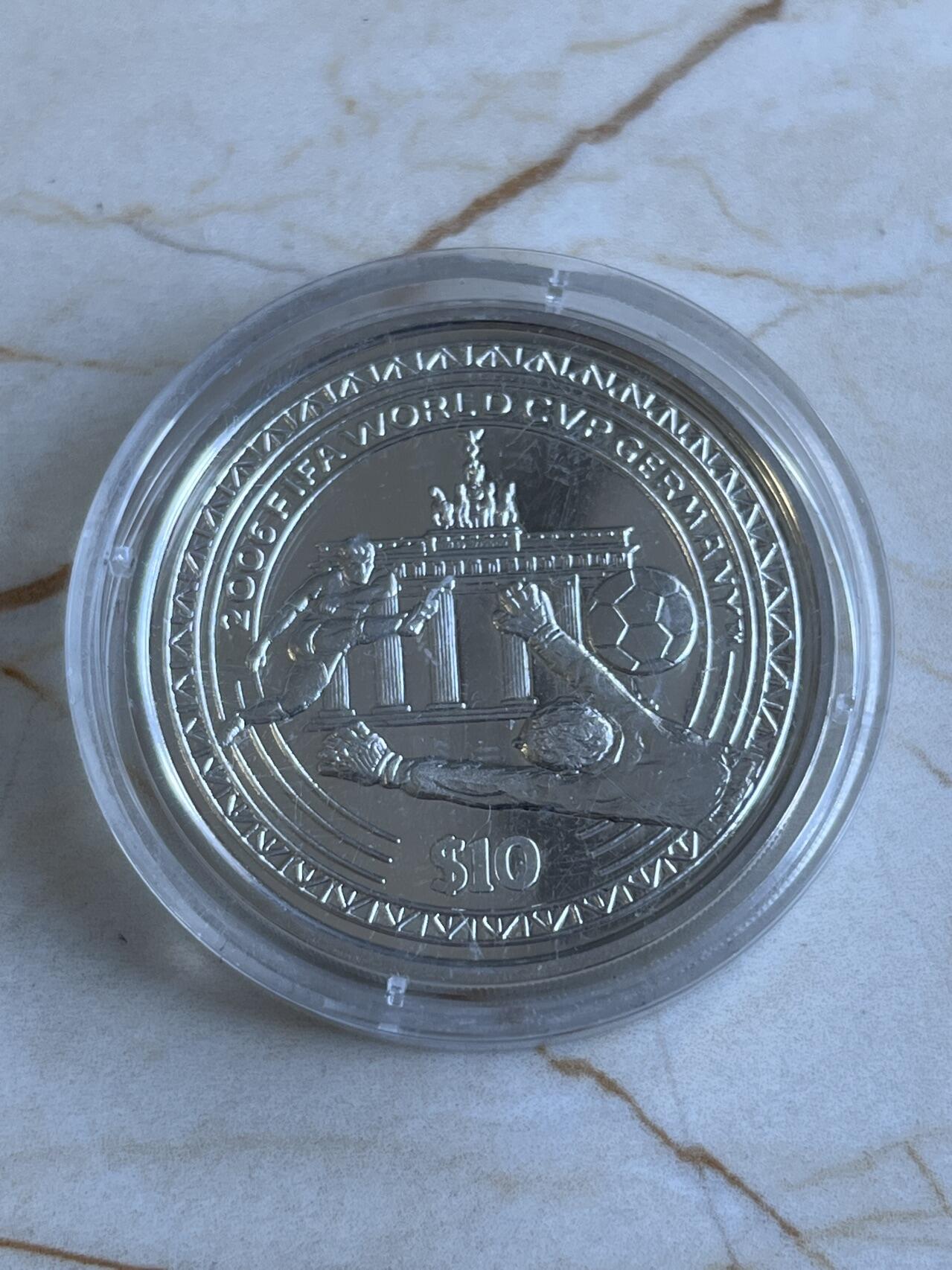 第166期拍卖【长期征集拍品】 塞拉利昂2006年世界杯足球纪念银币，925银，28.28克
