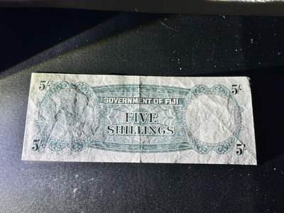 《外钞收藏家》第五百四十七期（本期稀少裸币、刀币、精品评级）（本平台长期征集拍品、欢迎藏友们联系合作） 1957年斐济5先令 非全新 品相如图