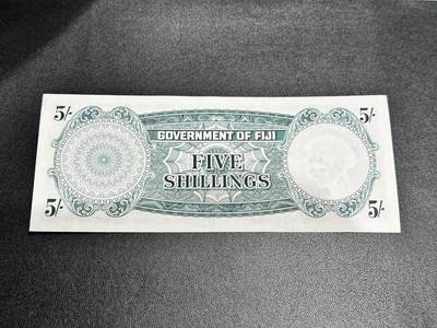 《外钞收藏家》第五百四十七期（本期稀少裸币、刀币、精品评级）（本平台长期征集拍品、欢迎藏友们联系合作） 1957年斐济5先令 非全新 品相如图