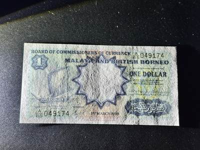 《外钞收藏家》第五百四十七期（本期稀少裸币、刀币、精品评级）（本平台长期征集拍品、欢迎藏友们联系合作） 1959年英属马来亚1元 非全新 品相如图 尾74