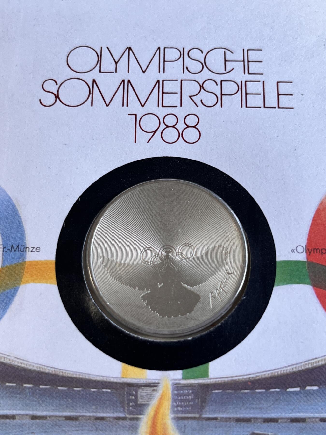 第166期拍卖【长期征集拍品】 获奖瑞士1988年汉城奥运和平鸽和五环纪念币首日封，获得克劳斯1990年度最佳艺术币大奖。