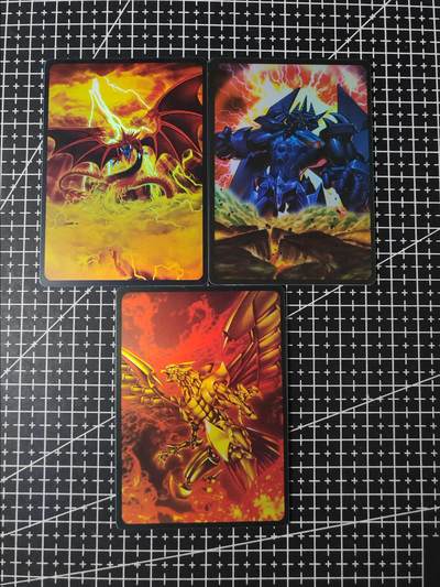 铃鹿第五期（提示一：自制卡难免瑕疵，可能存在撞角爆边等出厂瑕疵，介意慎拍；提示二：参拍请慎重，跑单押金不退的）） - 游戏王三幻神彩闪PVC材质卡